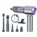 Aspirateur à main sans fil gris et violet avec ses embouts et son câble de charge
